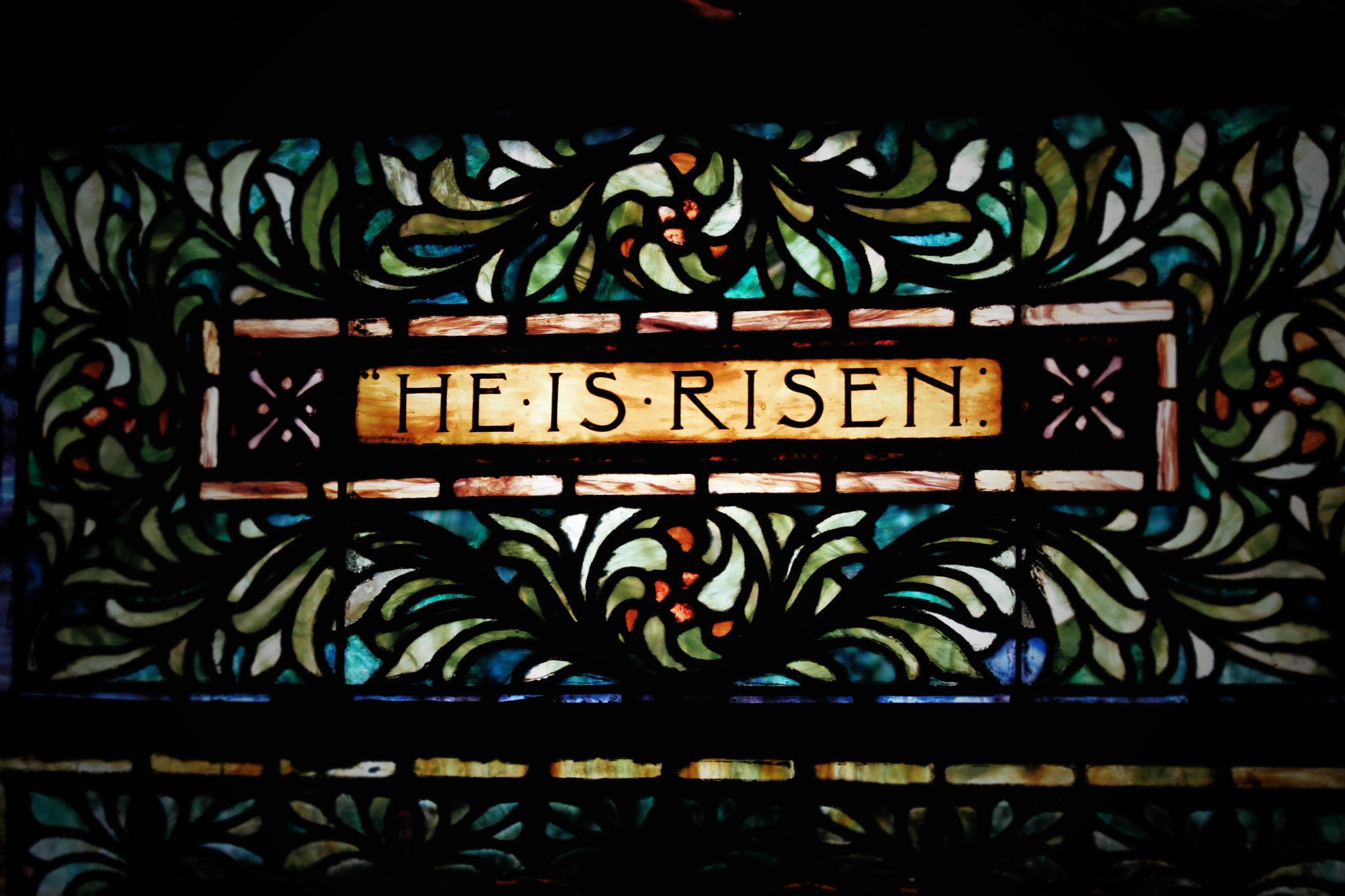 stained glass window with the words He is Risen at Third Presbyterian Church in Pittsburgh, PA