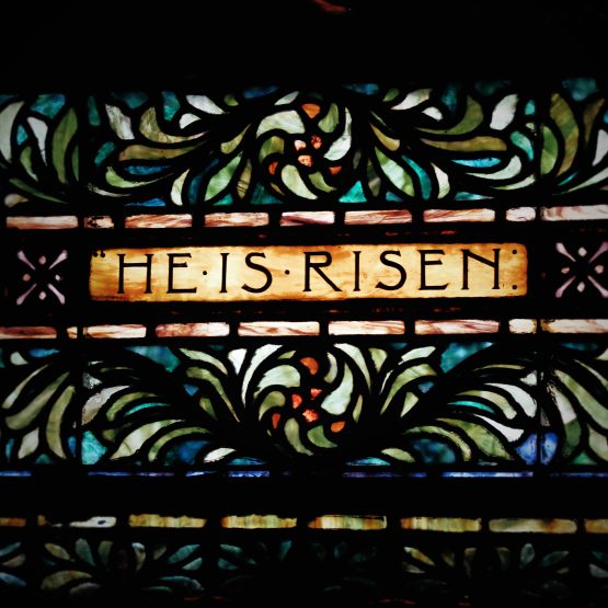 stained glass window with the words He is Risen at Third Presbyterian Church in Pittsburgh, PA