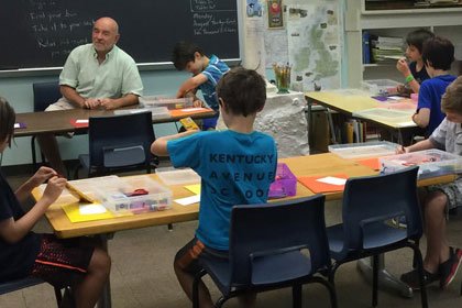 children working on an art program at the Kentucky Avenue School